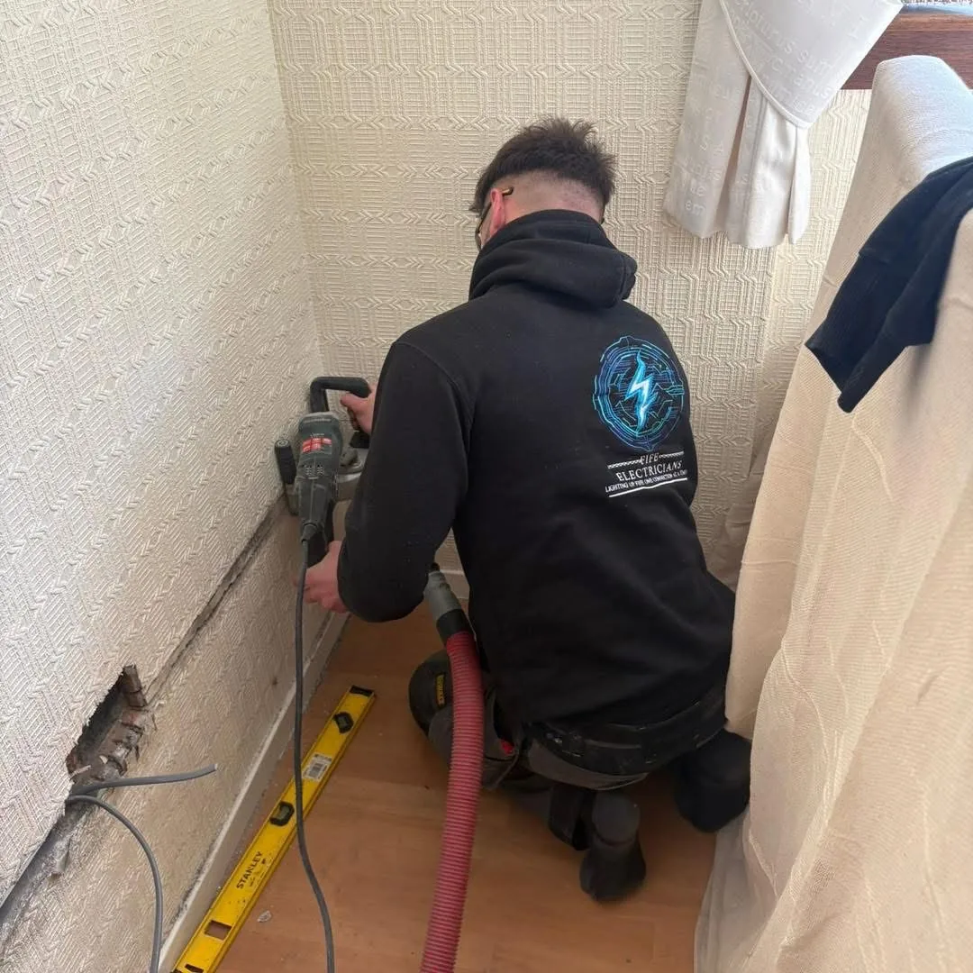 Haddon from Fife Electricians fitting new cabling during a house rewire